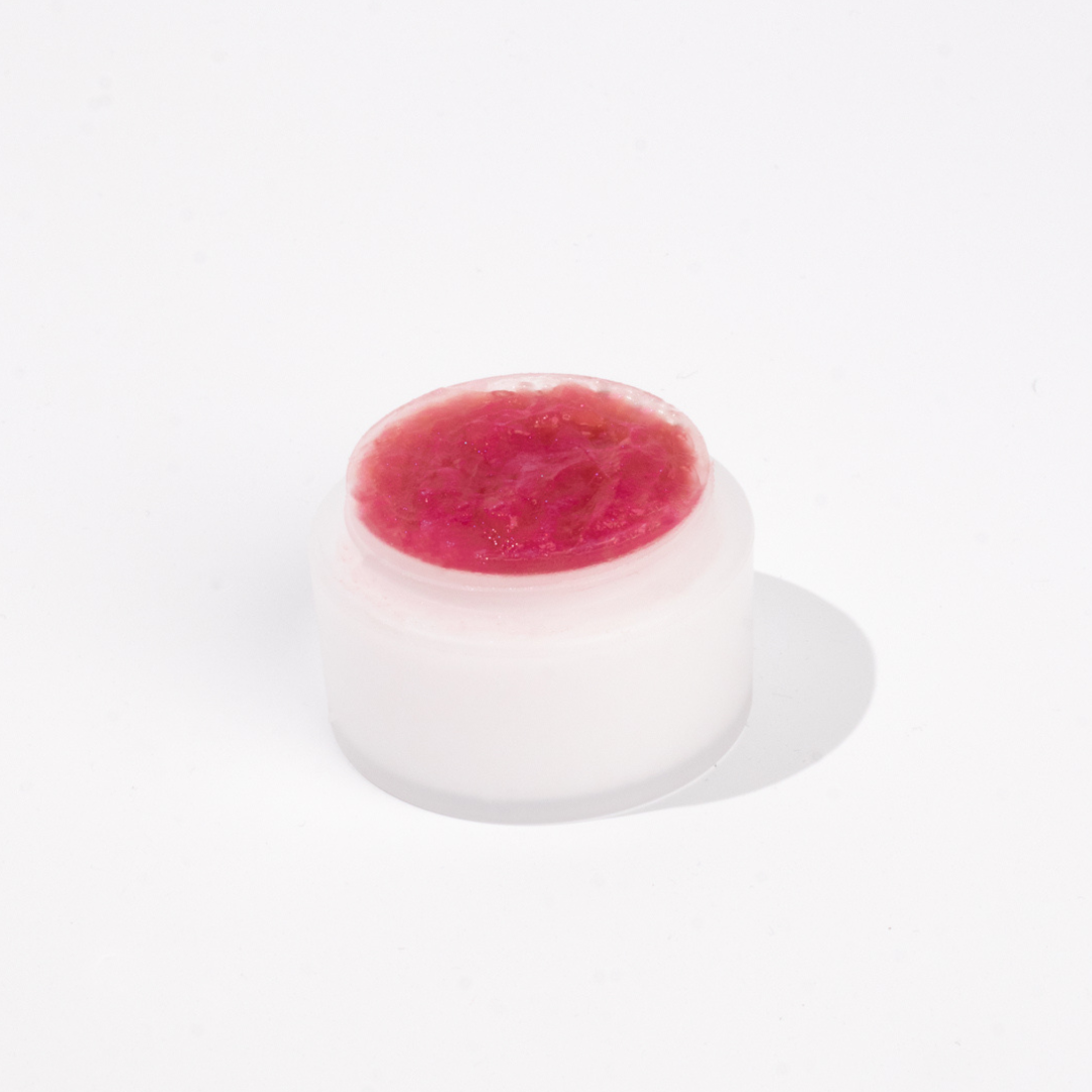 Pot of pink lash adhesive cream remover