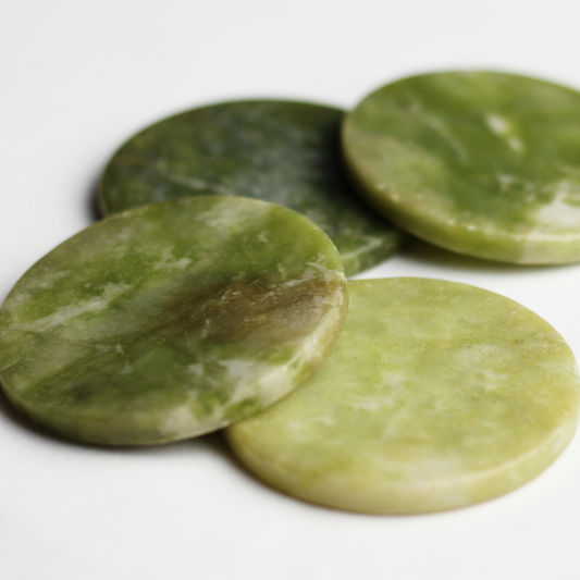 Green jade stones used for holding adhesive 